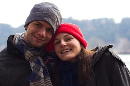 Cute couple smiling while being outdoors