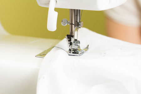 using a sewing machine and showing the sewing process