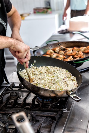 Risotto in a pan being cooked in a restaurantの写真素材