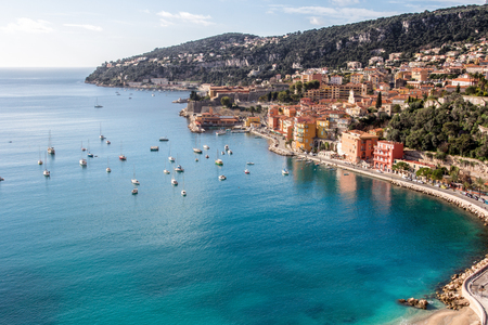 Beach of Eze sur mer in south of france with mountain in the backgroundの写真素材