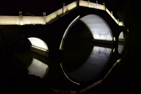 bridge and reflection in the water during nightのeditorial素材