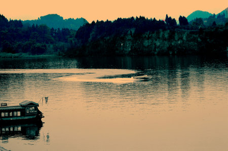 Landscape with a boat in the waterのeditorial素材