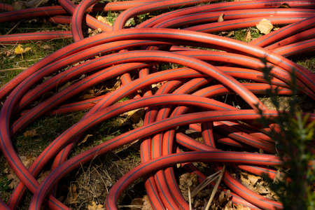close up red irrigation hose