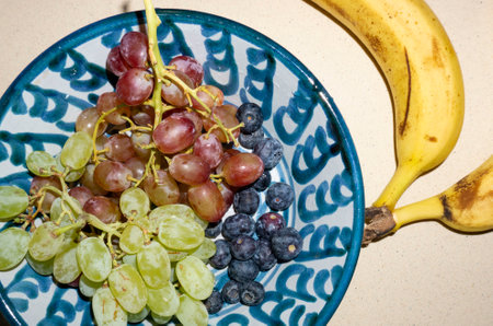 artisan bowl with different fruitsの写真素材