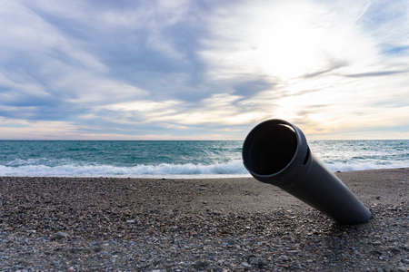 broken pipe in the middle of a beachの写真素材