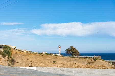 landscape with beach, houses and lighthouseの写真素材