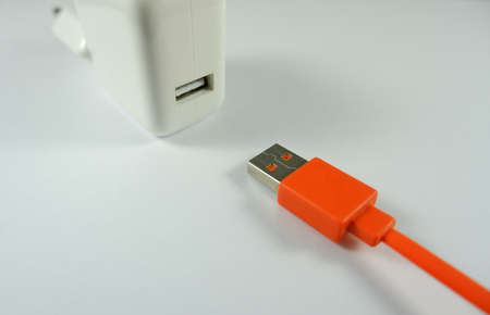 usb charger and cable on a white background close up