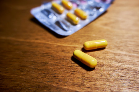 Pills in capsules on the tableの写真素材