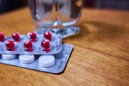 Packing of pills in a blister on the tableの写真素材