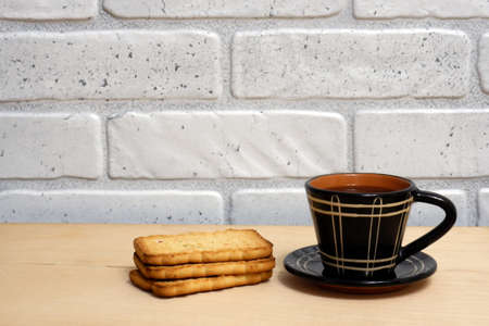 Cup of coffee and cookies on the table