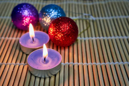 Lighted candles and Christmas decorationsの写真素材