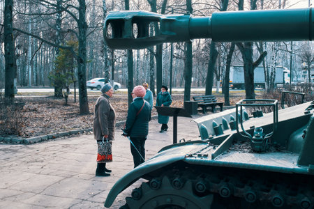 Ryazan, Russia - April 9, 2022: Tank gun barrel against the backdrop of people walking in the parkのeditorial素材
