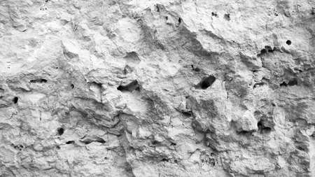 Black and white stone texture. Raw stone closeup