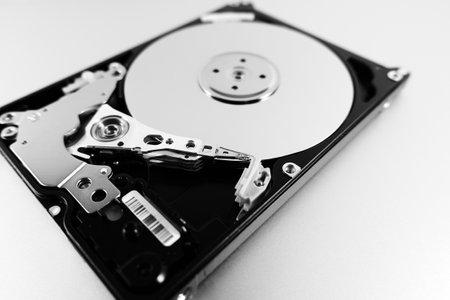 Computer hard drive with top cover removed. Disassembled HDD of a personal computer. Selective Focusの写真素材