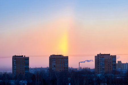 Rainbow over the city in frosty weather. A rare optical phenomenonの写真素材