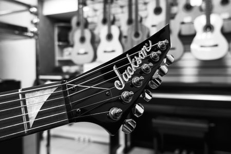 Ryazan, Russia - January 9, 2024: Jackson guitar headstock close up, black and white, selective...