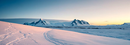 Panoramic view of snow-capped mountains at sunset, Antarcticaの素材