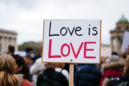 A close-up of the âLove is Loveâ poster at a public meetingの素材