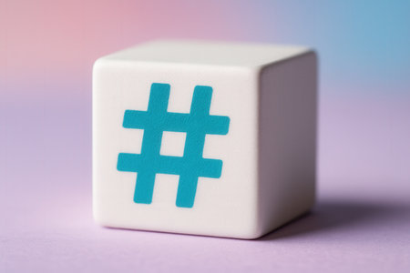 Hashtag icon on a white cube on a pink and blue backgroundの素材