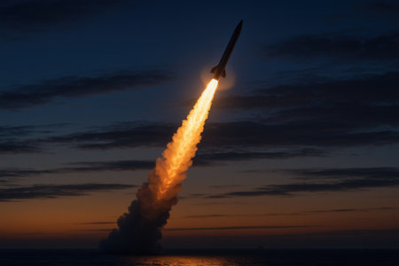 A rocket takes off from the sea at sunset.の素材