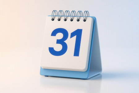 Blue Desk Calendar Displaying Number 31 on White Page with Spiral Bindingの素材
