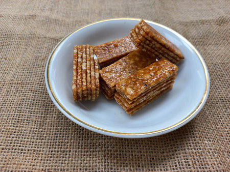 stack of ting ting enting enting indonesian traditional sweet peanut brown sugar candy snackの写真素材