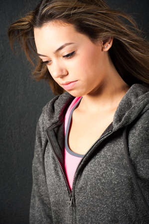 Attractive female fitness model isolated on a black background in sports wearの写真素材