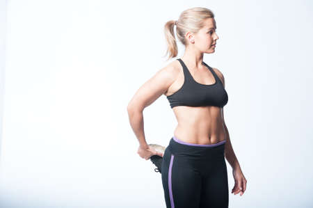 Image of fitness woman in sports clothing Young female model with muscular bodyの写真素材