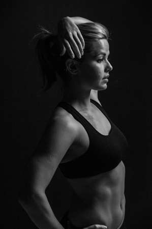Image of fitness woman in sports clothing Young female model with muscular bodyの写真素材