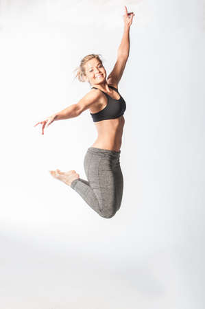 Image of fitness woman in sports clothing Young female model with muscular bodyの写真素材