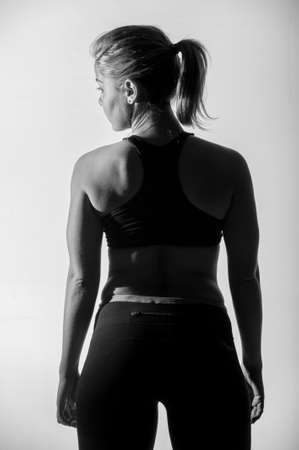 Image of fitness woman in sports clothing Young female model with muscular bodyの写真素材