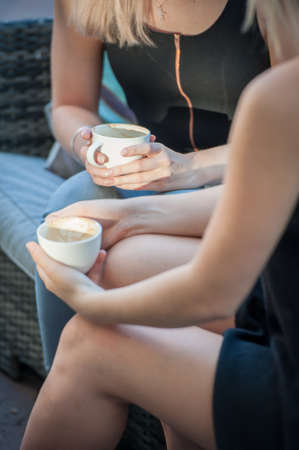 close up image of a girl holding an empty coffee cupの写真素材