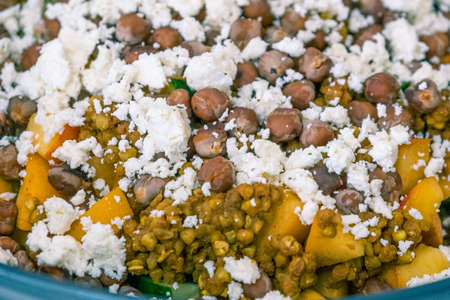 healthy and vibrant bowl of buckwheat and vegetable salad ready for sharingの写真素材