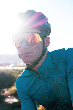 vibrant portrait of a dirty mountain biker
