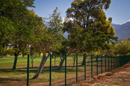 newly installed mesh fence protecting a golf courseの写真素材