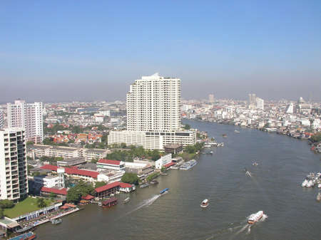 The skyline of Bangkok in Thailand with the big river flowing through itの写真素材