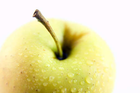 Delicious and fresh yellow apple isolated on a white backgroundの写真素材