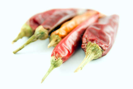 Red and yellow chili pepper isolated on a white background