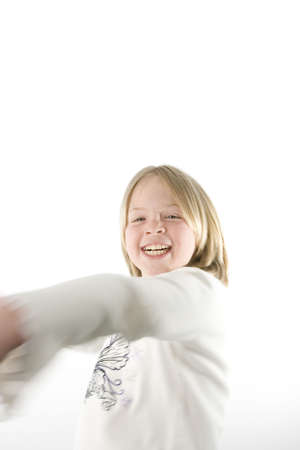 A girl having fun in front of the cameraの写真素材