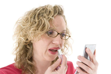 Attractive blonde with glasses and a lipstick isolated on white の写真素材