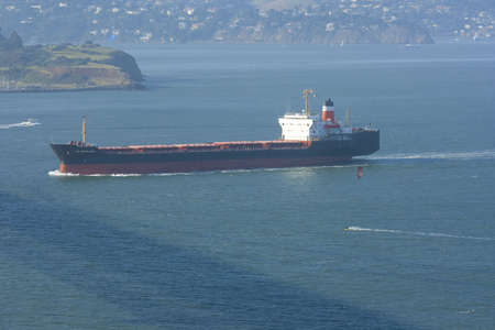 Containership with containers leaving the harbor