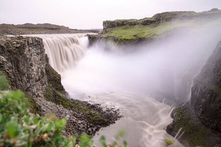 Dettifoss is the most powerful waterfall on Iceland and in the whole Europe  It is located in Jokulsargljufur National Park the northeasten Iceland on the river Jokulsa a Fjollum の写真素材