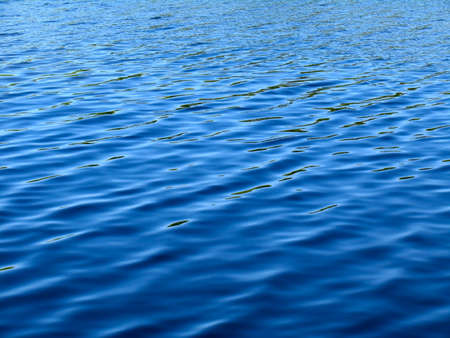 Waves on surface of water. Deep blue colorの写真素材