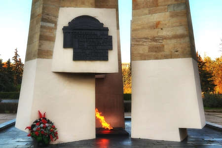 Eternal flame and obelisk at MSU. Caption on black bas relief from russian: For students and teachers of the Moscow State University for the Great Patriotic War 1941-1945, October 13, 2015, Moscow, Russiaのeditorial素材