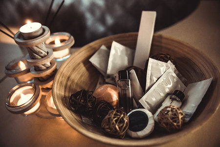 Birch bark basket with gift creams and beauty products. Retro sepia tone.
