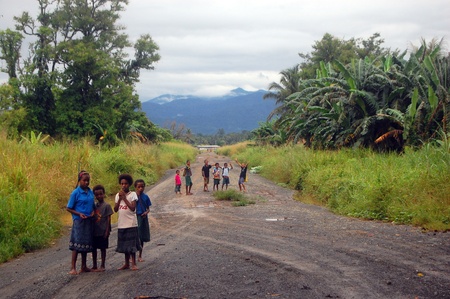 Children on the road, near the village in Papua New Guineaのeditorial素材