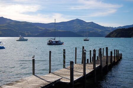 Timber pier in Akaroa bay, Banks Peninsula, New Zealandのeditorial素材