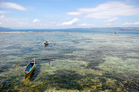 Fishing boats at ocean bay near coast Indonesia, Jayapuraの写真素材