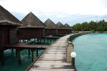 Bungalow and timber pier at island resort Maldives, Asia, Indian Oceanの写真素材