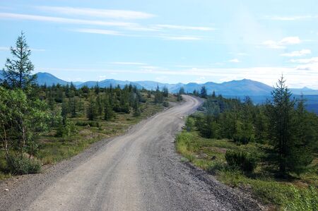 Gravel road at tundra mountains area Chukotka, Russiaの写真素材